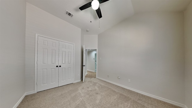 unfurnished bedroom with baseboards, a closet, visible vents, and light colored carpet