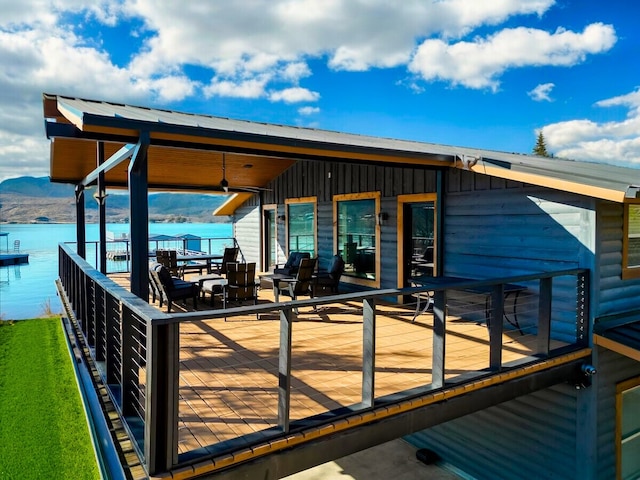 wooden deck with a water view