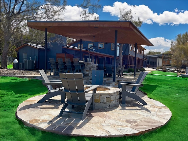 view of patio with a fire pit and central AC unit