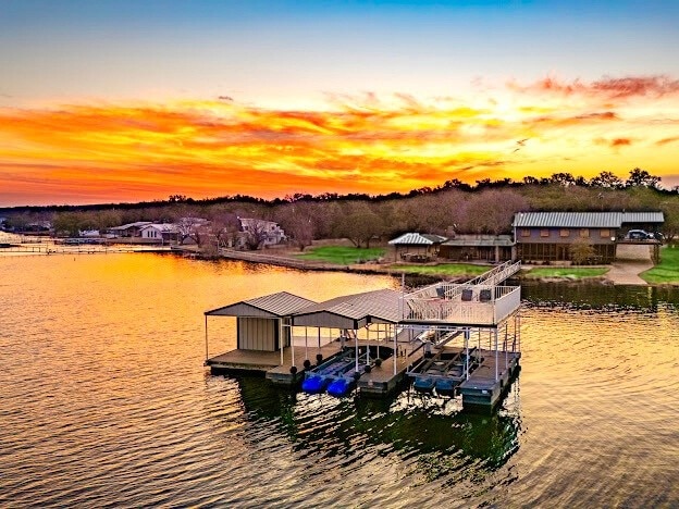 dock area featuring a water view and boat lift