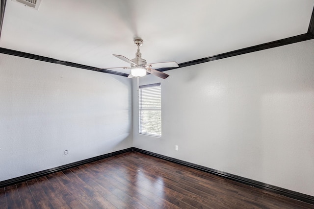 unfurnished room with dark wood-style flooring, visible vents, ornamental molding, a ceiling fan, and baseboards