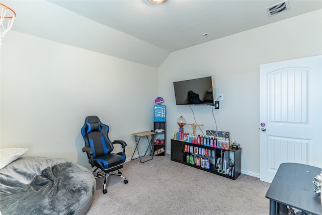 interior space featuring vaulted ceiling, carpet flooring, visible vents, and baseboards