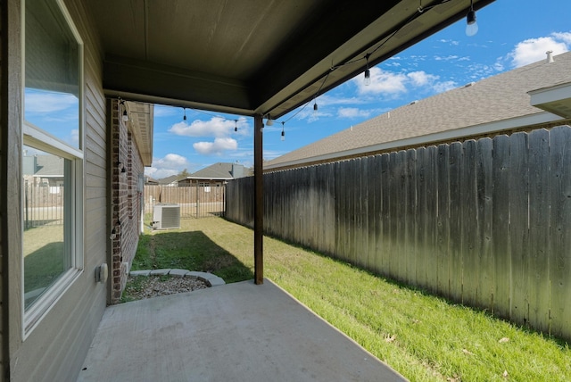 view of yard featuring a patio area, a fenced backyard, and cooling unit