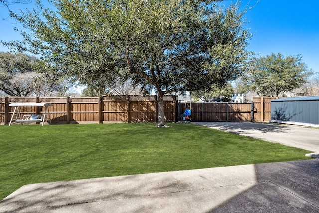 view of yard with a fenced backyard