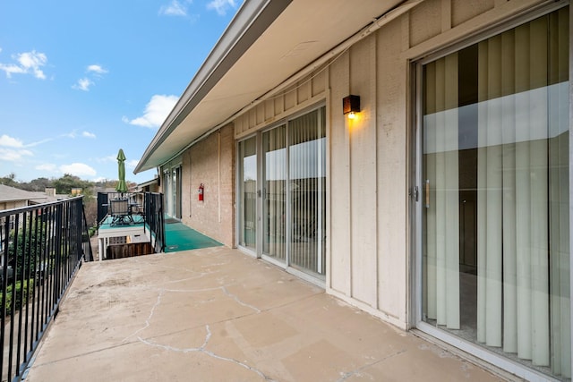 view of patio with a balcony