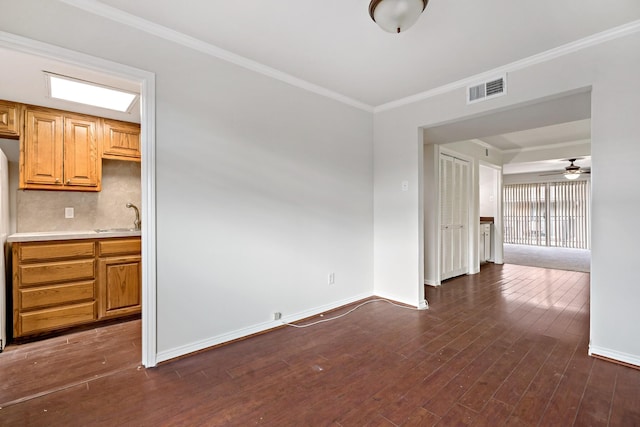 interior space featuring dark wood finished floors, visible vents, and baseboards