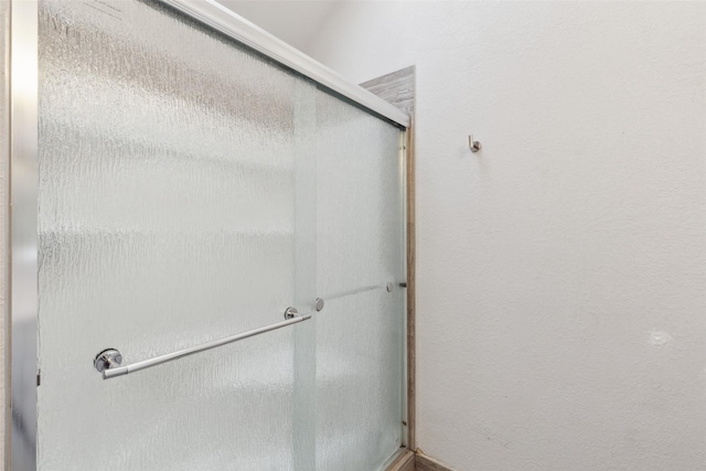 full bathroom featuring a shower stall