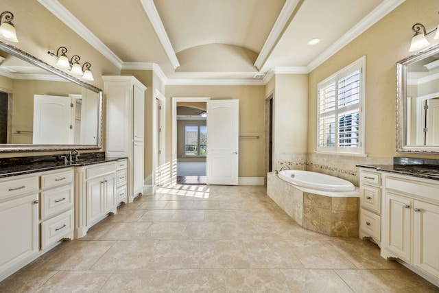 full bath with a garden tub, ornamental molding, vanity, and vaulted ceiling