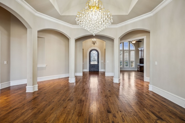 entrance foyer with ceiling fan with notable chandelier, dark wood-style flooring, and baseboards