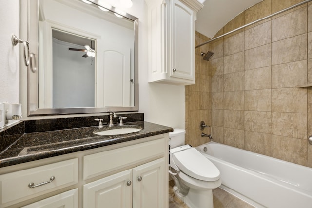 bathroom featuring bathing tub / shower combination, toilet, vanity, and a ceiling fan