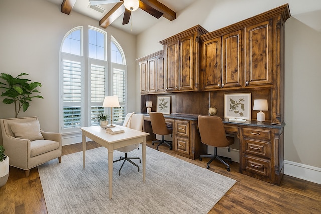 2161 Meadow View Dr, Prosper, TX 75078 - home office featuring ceiling fan, beamed ceiling, and dark wood-style flooring