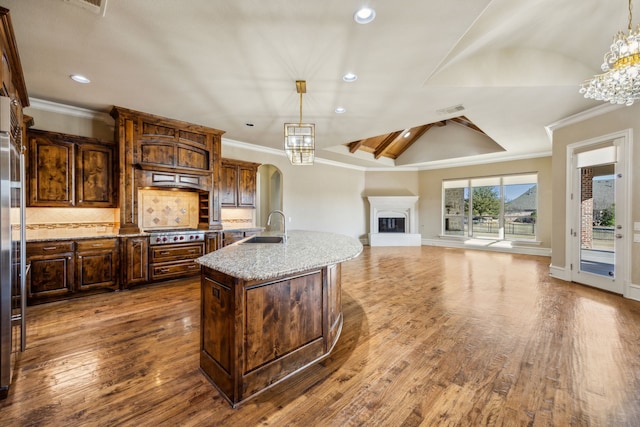 2161 Meadow View Dr, Prosper, TX 75078 - kitchen with an island with sink, a chandelier, appliances with stainless steel finishes, recessed lighting, and lofted ceiling