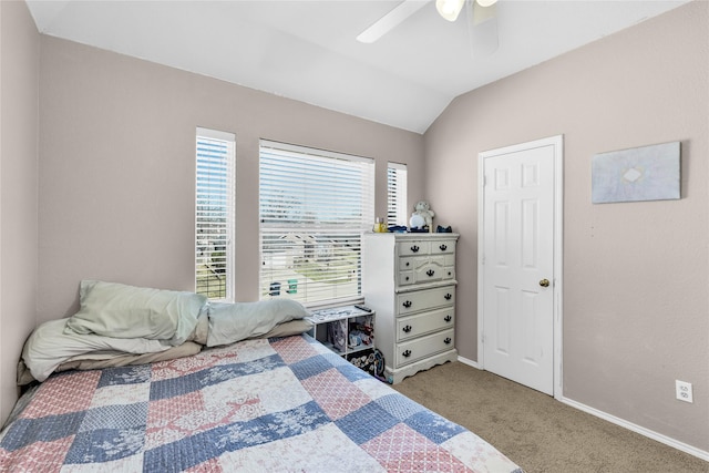 carpeted bedroom featuring lofted ceiling, a ceiling fan, and baseboards