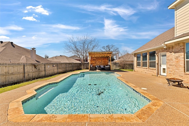 view of swimming pool featuring a patio area, a fenced backyard, outdoor lounge area, and a fenced in pool