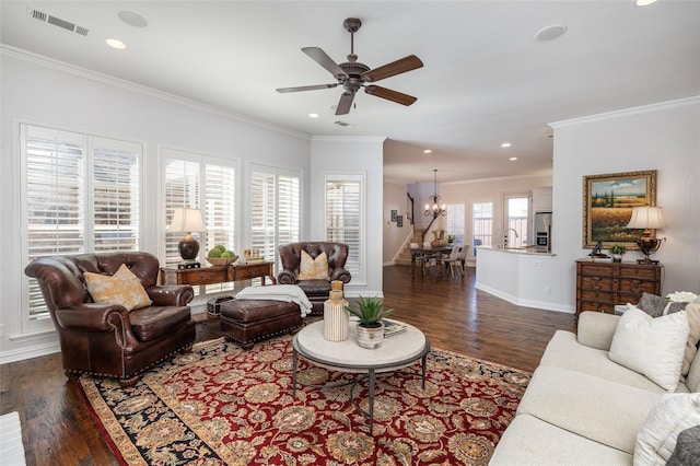 living room with baseboards, dark wood-type flooring, visible vents, and crown molding