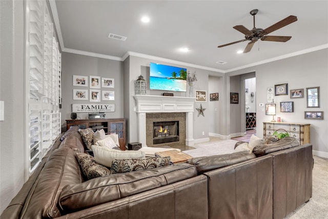 living area with light colored carpet, a fireplace with flush hearth, visible vents, baseboards, and crown molding