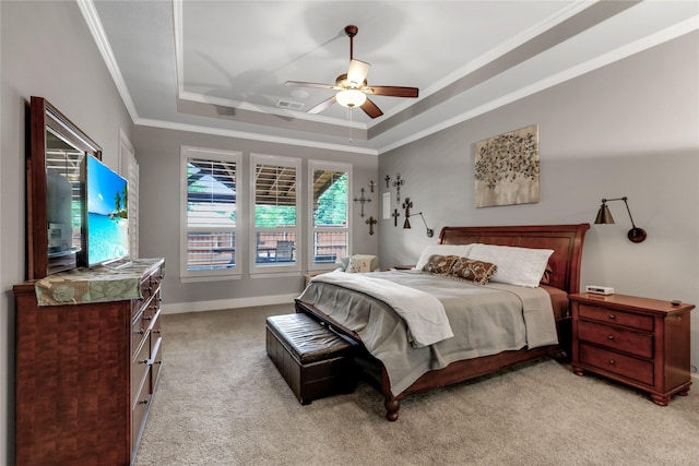 bedroom with light carpet, baseboards, visible vents, a raised ceiling, and crown molding