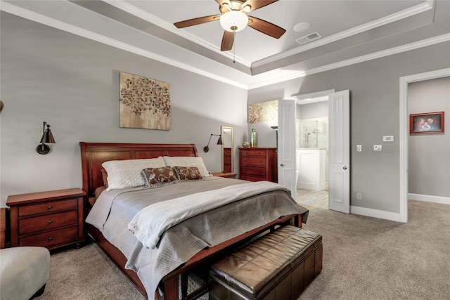 bedroom with carpet flooring, visible vents, baseboards, a raised ceiling, and crown molding