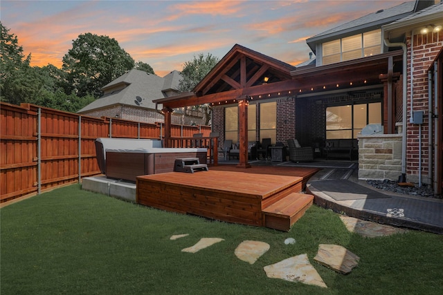 2104 Germantown, Mckinney, TX 75070 - yard at dusk with a hot tub, a deck, and a fenced backyard