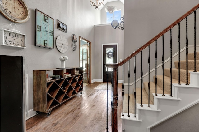 2104 Germantown, Mckinney, TX 75070 - entrance foyer with a high ceiling, an inviting chandelier, baseboards, wood finished floors, and stairway