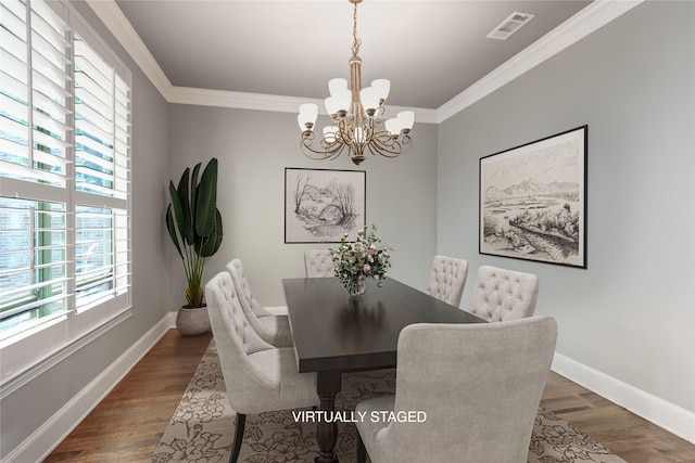 2104 Germantown, Mckinney, TX 75070 - dining area featuring dark wood-style flooring, a notable chandelier, baseboards, visible vents, and ornamental molding