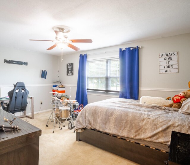 bedroom with carpet and a ceiling fan