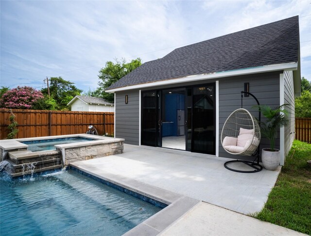 view of pool featuring a fenced in pool, a patio area, a fenced backyard, and an in ground hot tub