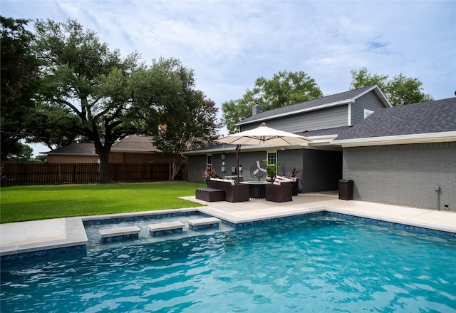 view of pool featuring a fenced in pool, a yard, outdoor lounge area, a patio area, and fence