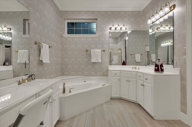 bathroom with a sink, wallpapered walls, and a stall shower