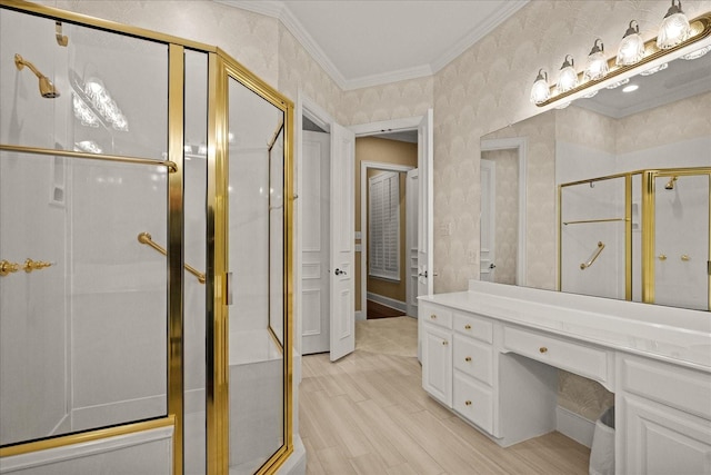 full bathroom with crown molding, vanity, a shower stall, wood finished floors, and wallpapered walls