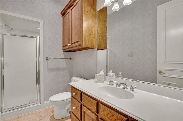 bathroom with a shower stall, tile patterned floors, wallpapered walls, and toilet