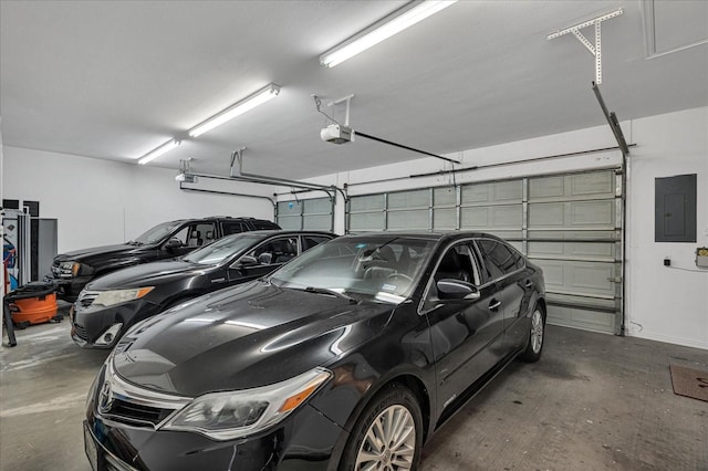 garage featuring a garage door opener and electric panel