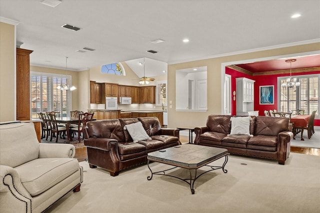 living room featuring an inviting chandelier and crown molding
