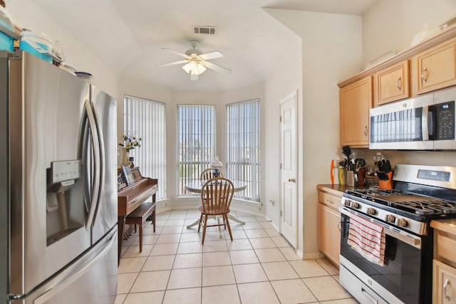 kitchen with light tile patterned floors, visible vents, ceiling fan, appliances with stainless steel finishes, and light brown cabinetry