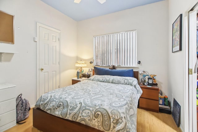 bedroom featuring ceiling fan and wood finished floors