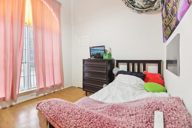 bedroom featuring wood finished floors