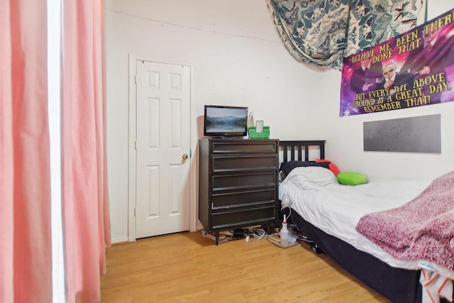 bedroom featuring wood finished floors