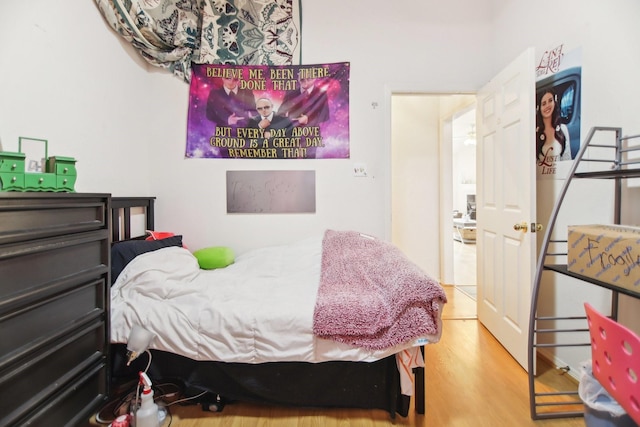 bedroom with wood finished floors