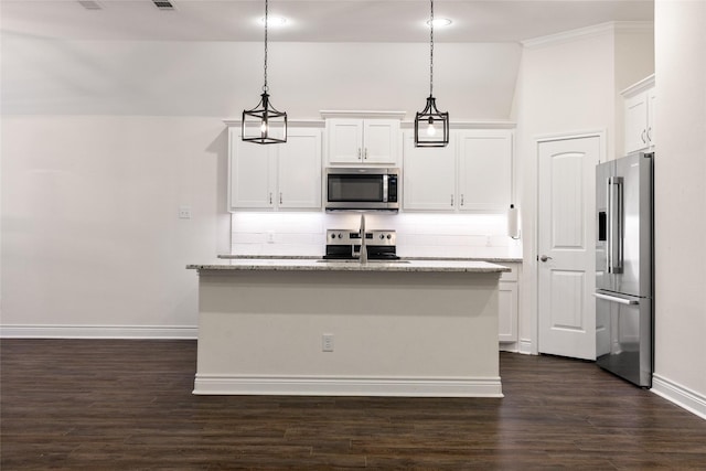 kitchen with appliances with stainless steel finishes, white cabinets, a kitchen island with sink, and backsplash