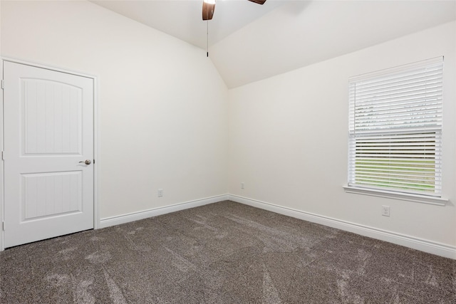 unfurnished room featuring lofted ceiling, ceiling fan, carpet, and baseboards