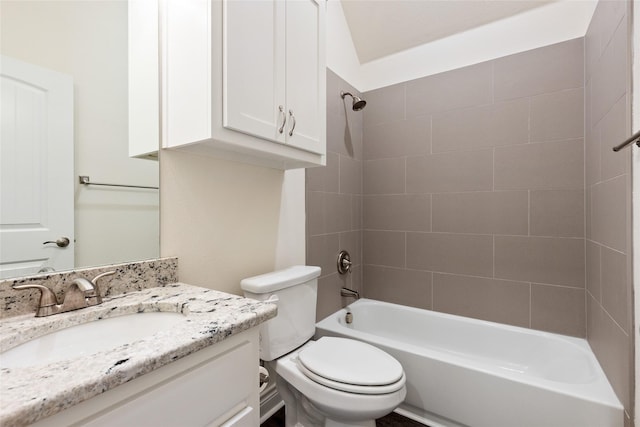 full bath featuring toilet, vanity, and bathing tub / shower combination