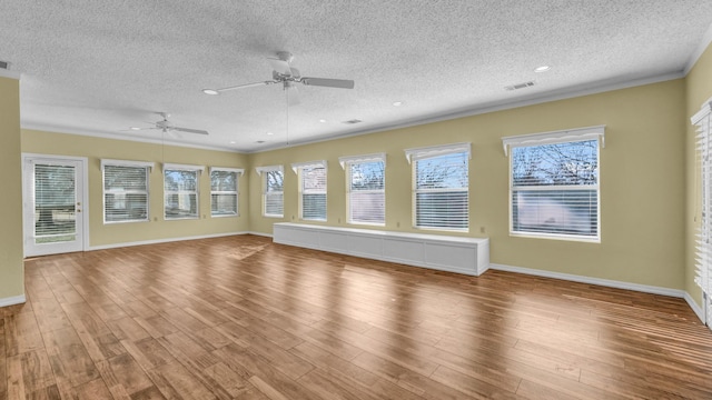 unfurnished living room with recessed lighting, visible vents, baseboards, and wood finished floors