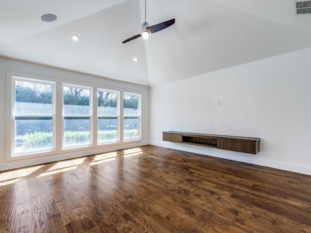 unfurnished living room with a ceiling fan, baseboards, wood finished floors, visible vents, and high vaulted ceiling