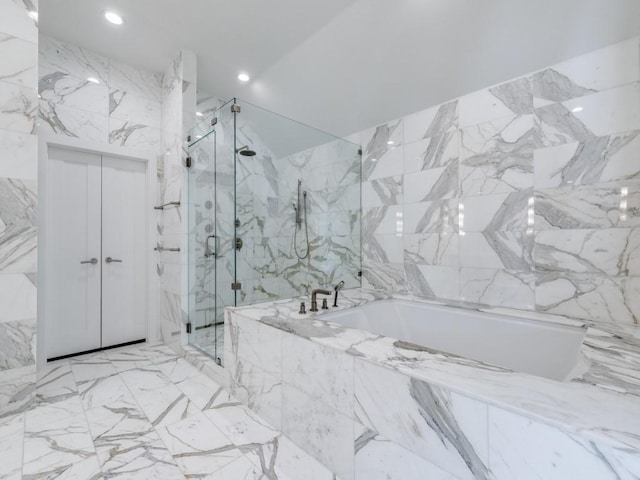 full bathroom featuring stone wall, a bath, recessed lighting, and a marble finish shower