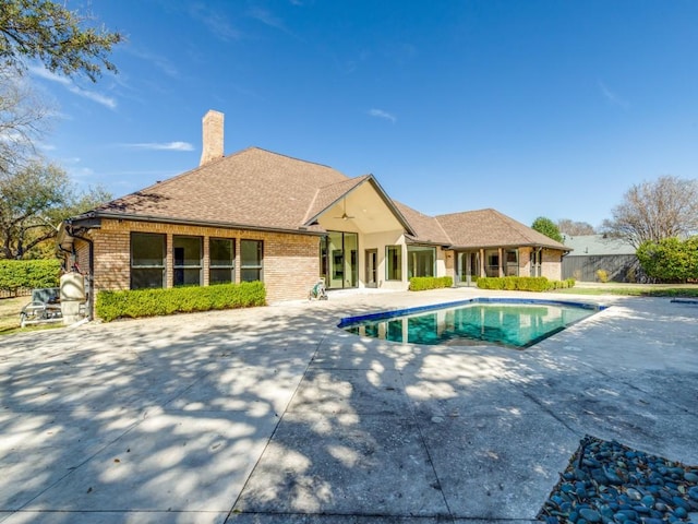 view of swimming pool featuring a patio, a fenced in pool, and fence