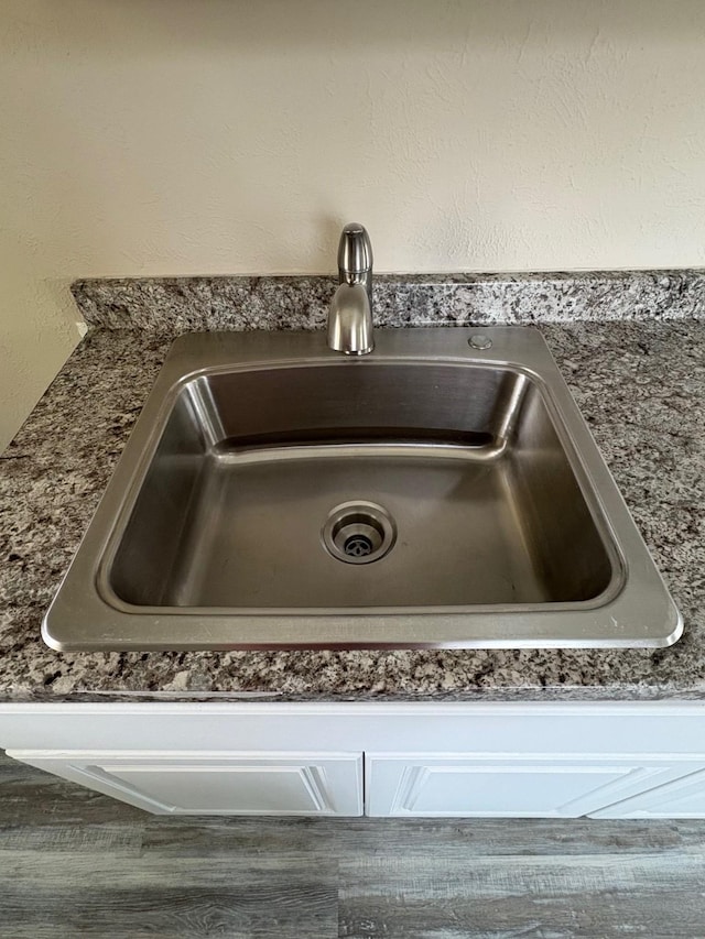 interior details featuring a sink