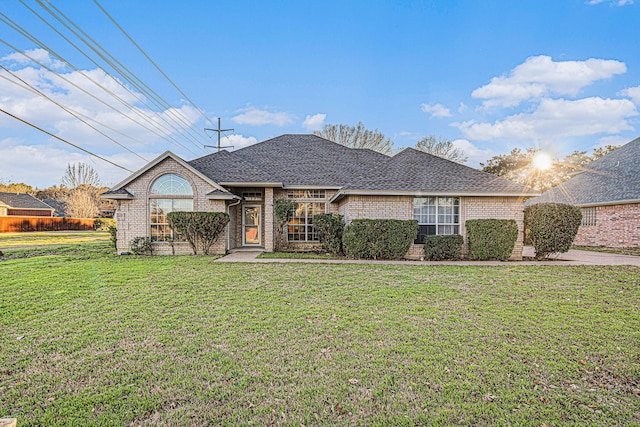 6417 Lago Vista Dr, Benbrook, TX 76132 - view of front of property with brick siding, a shingled roof, and a front yard