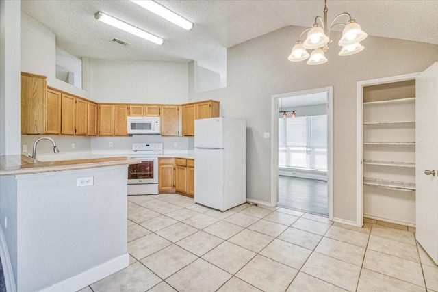 kitchen featuring light countertops, white appliances, light tile patterned flooring, and visible vents