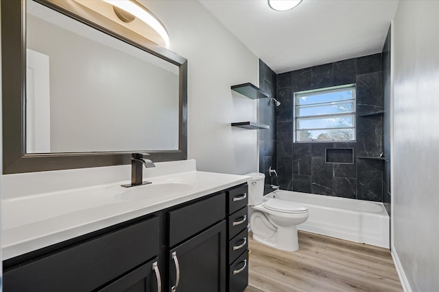 bathroom featuring shower / bath combination, vanity, toilet, and wood finished floors