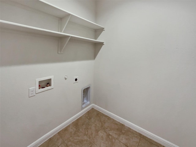 washroom with laundry area, baseboards, hookup for a gas dryer, hookup for a washing machine, and hookup for an electric dryer